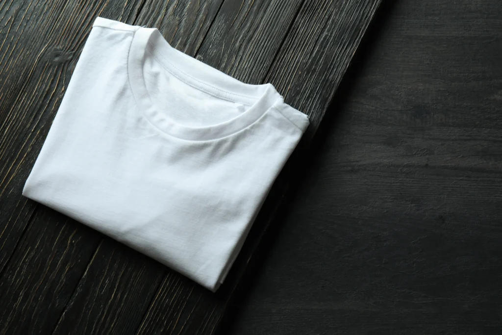 How to get rid of sweat stains from white shirts shown on a clean folded white shirt